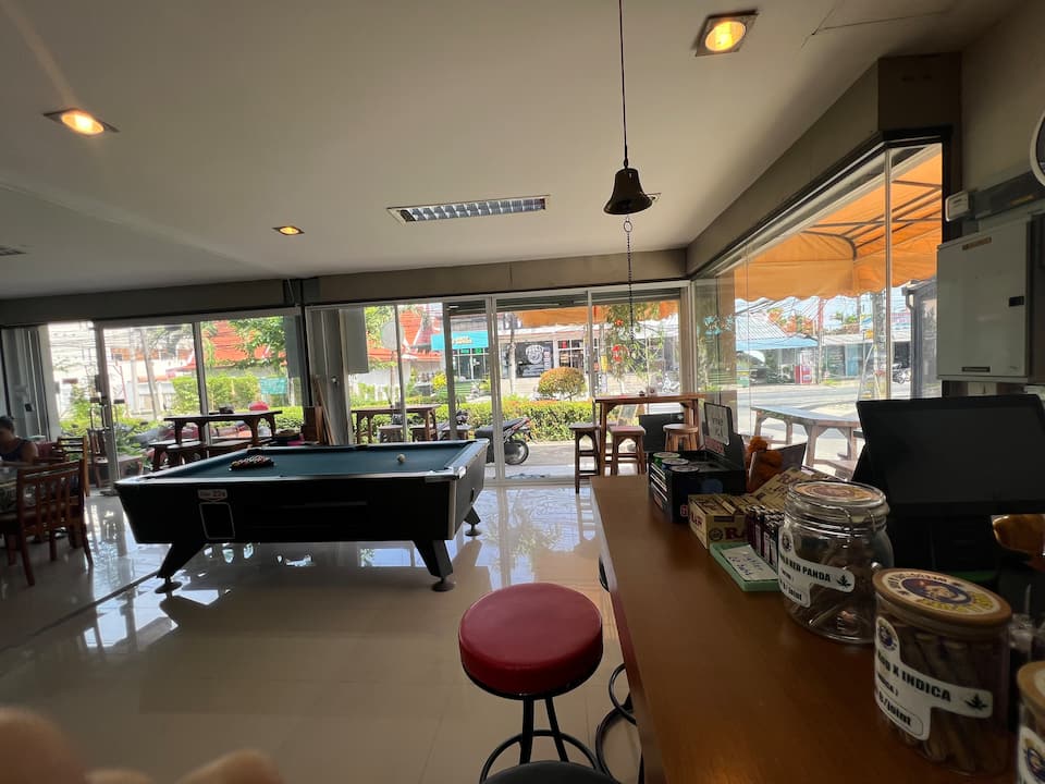 Bar with pool table and big windows